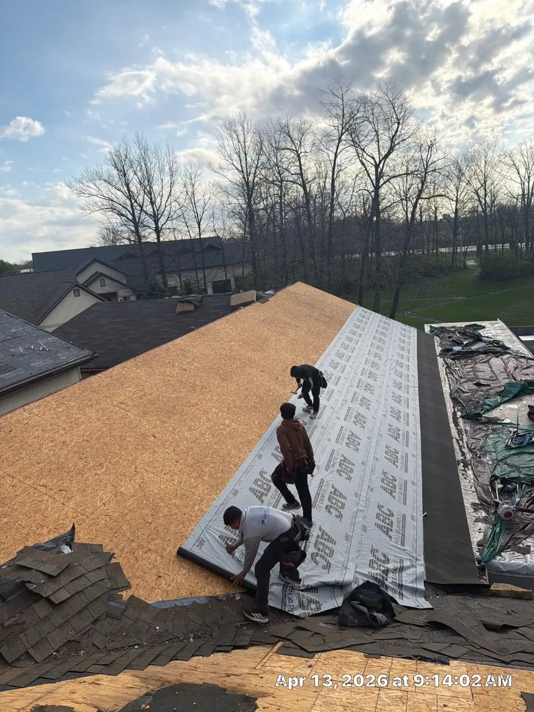 Tarping and dry-in on a Bedford commercial roof